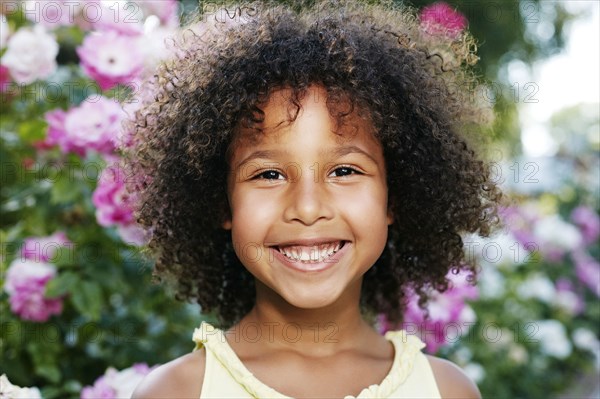 Mixed Race girl smiling outdoors