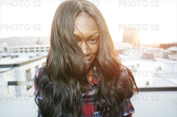 Portrait of Black woman on rooftop