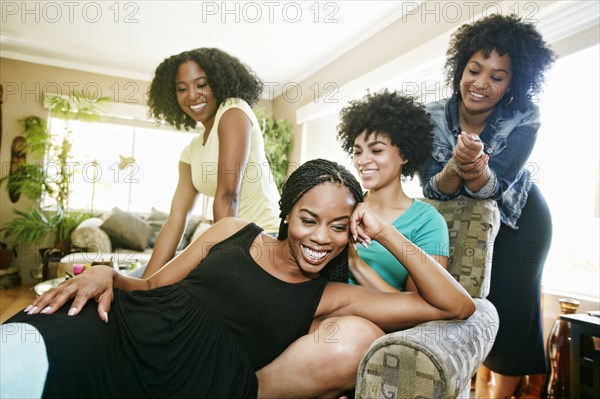 Women relaxing in armchair