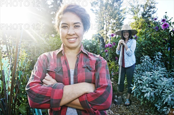 Smiling women posing in garden