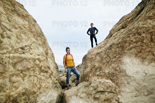 Portrait of smiling women posing on rock formation