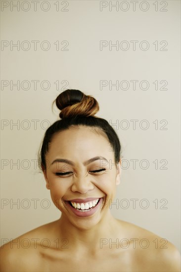 Portrait of laughing Asian woman