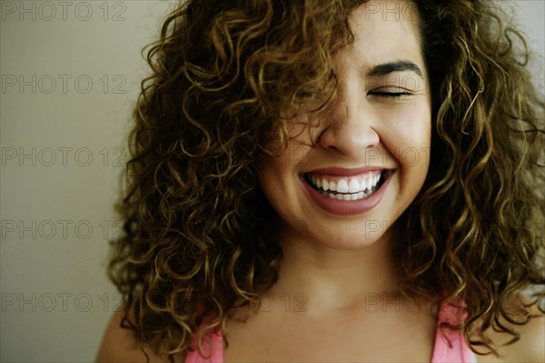 Portrait of laughing Mixed Race woman