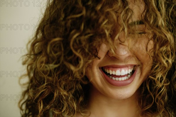 Portrait of laughing Mixed Race woman