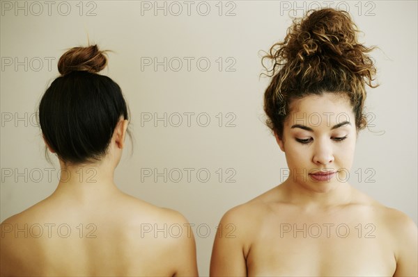 Front and rear view of shoulders of naked women