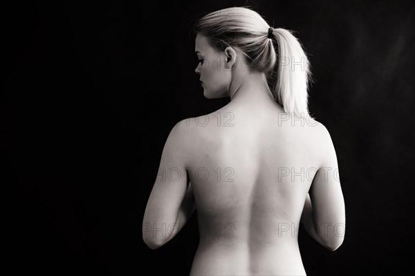 Rear view of naked Caucasian woman