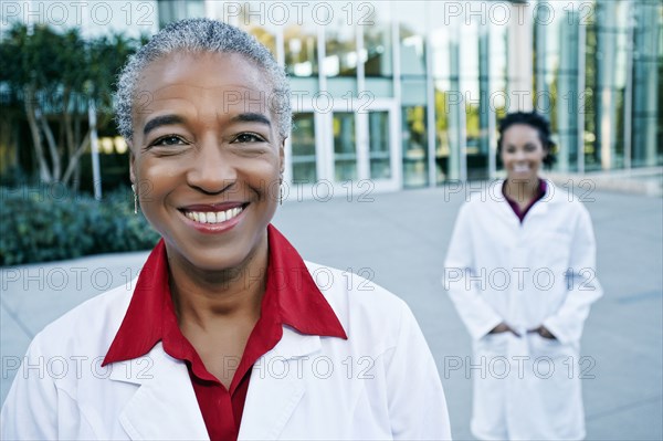 Portrait of smiling doctor outdoors at hospital