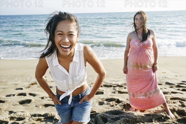 Women laughing on beach