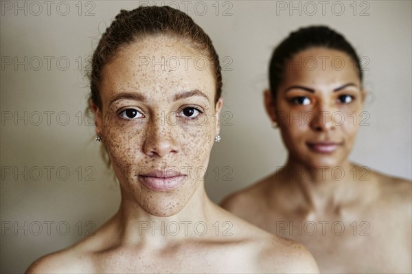 Close up of serious mixed race women