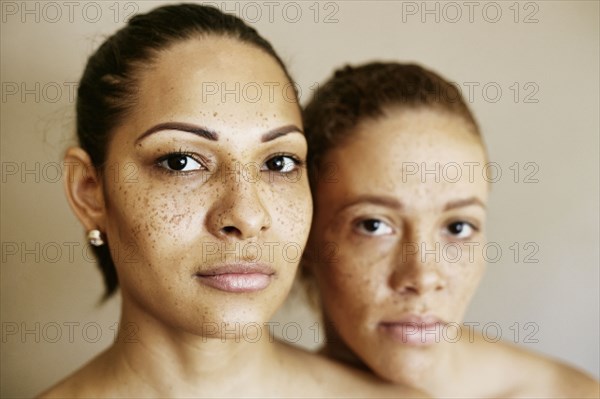 Close up of serious mixed race women