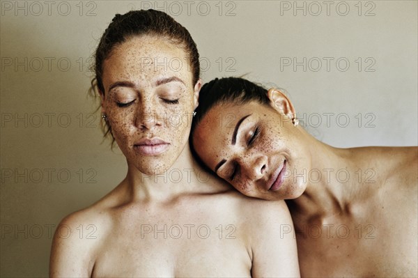 Close up of affectionate mixed race women