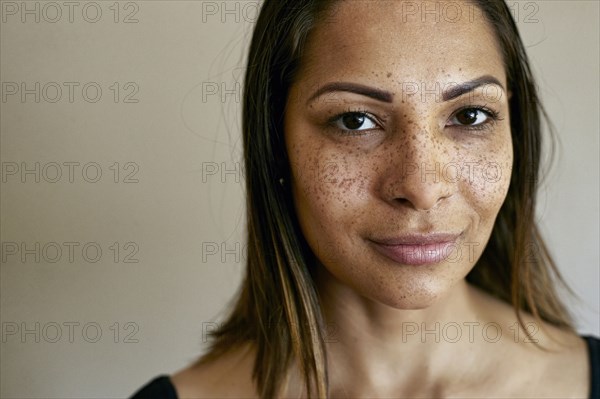 Close up of smiling mixed race woman