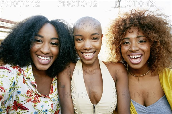 Portrait of women smiling outdoors