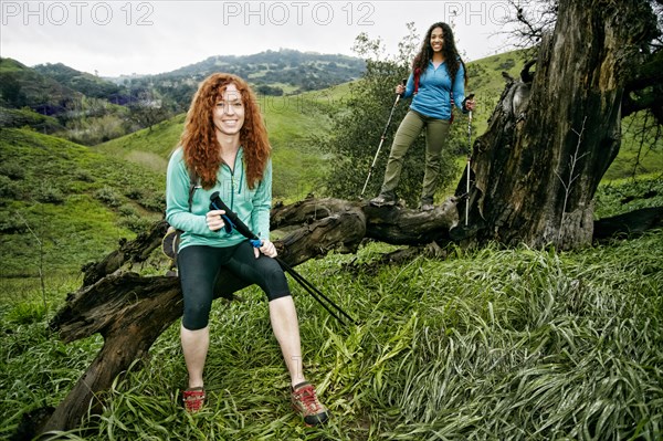 Portrait of hikers holding walking sticks