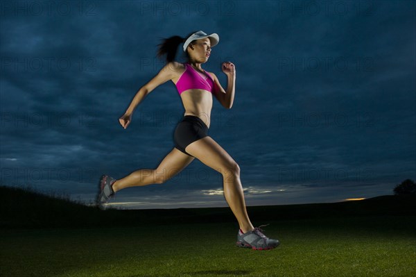 Japanese woman running at night