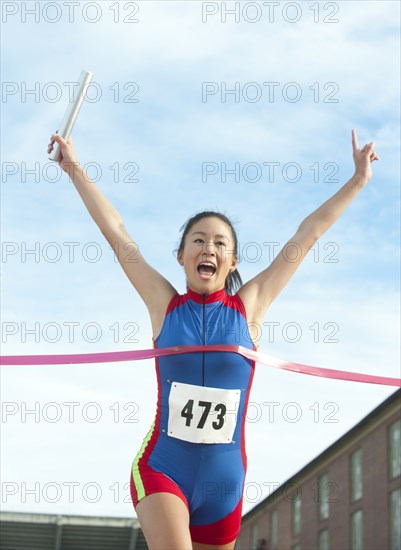 Japanese relay runner winning race