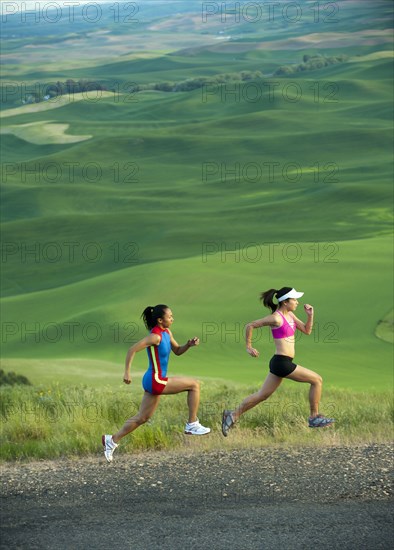 Women runners running in countryside