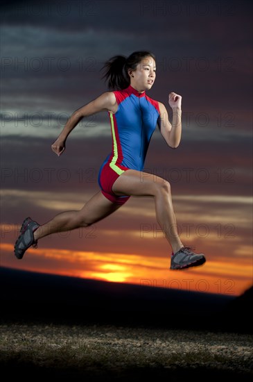 Japanese runner running at sunset