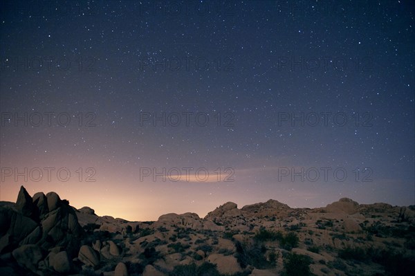 Stars in sky over desert