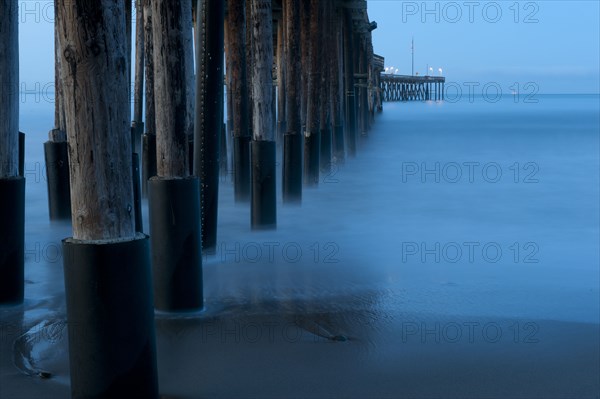 Ocean and dock pilings at beach