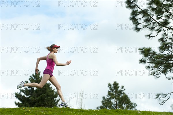 Mixed race woman running outdoors