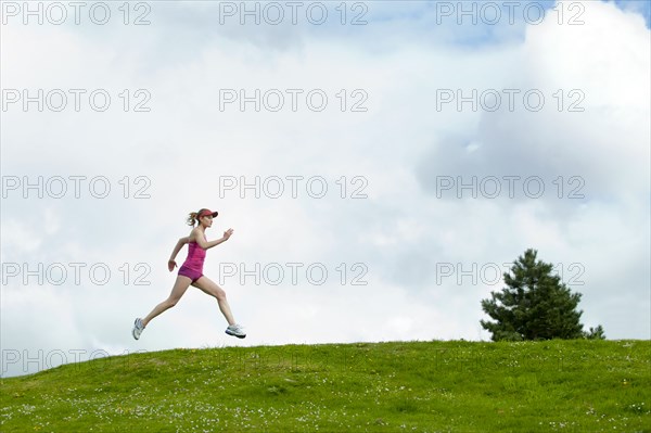 Mixed race woman running outdoors