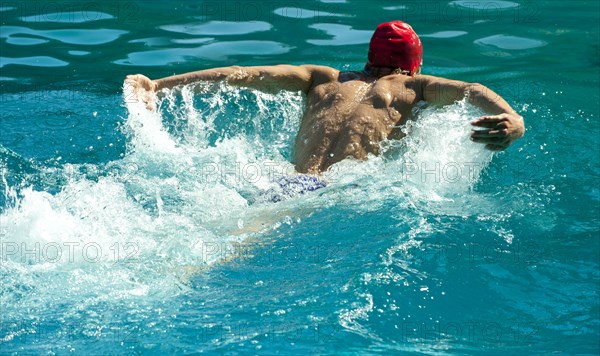 Caucasian swimmer training in swimming pool