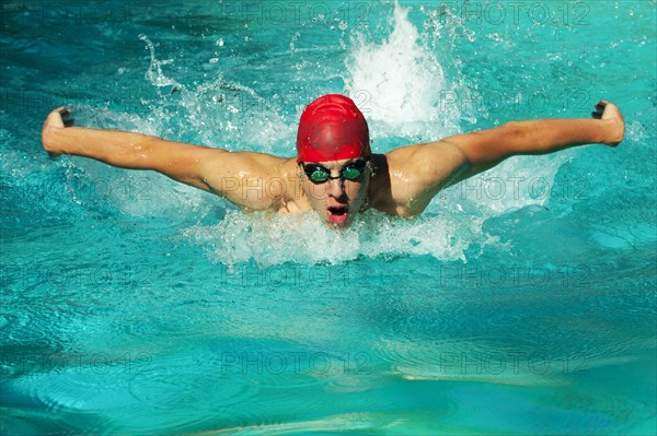 Caucasian swimmer training in swimming pool