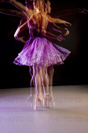 Caucasian ballerina dancing on stage