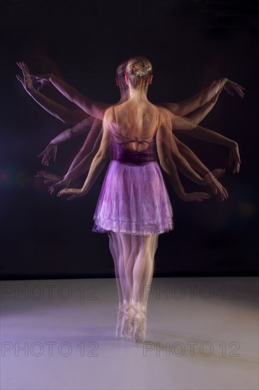 Caucasian ballerina dancing on stage
