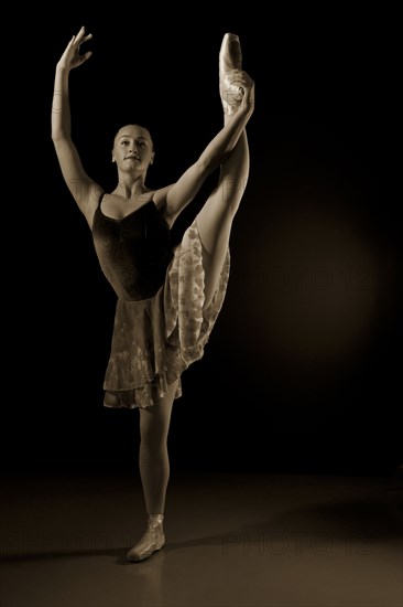 Caucasian ballerina dancing on stage