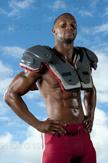 Black football player in shoulder pads