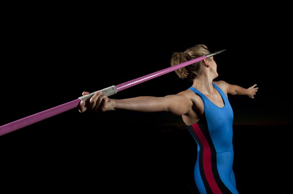 Caucasian athlete aiming javelin