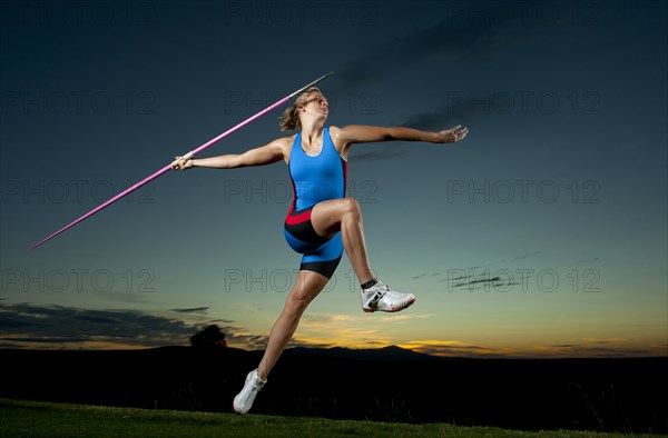 Caucasian athlete aiming javelin