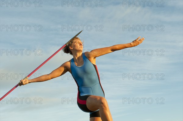 Caucasian athlete aiming javelin