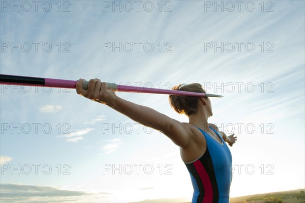 Caucasian athlete aiming javelin