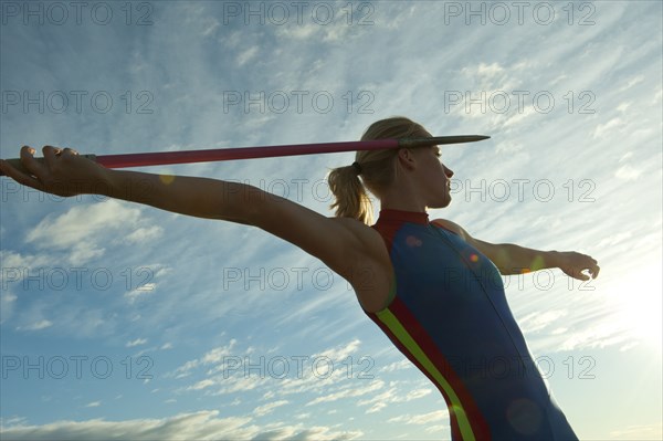 Caucasian athlete aiming javelin