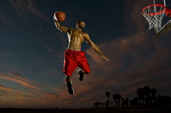 Black man playing basketball