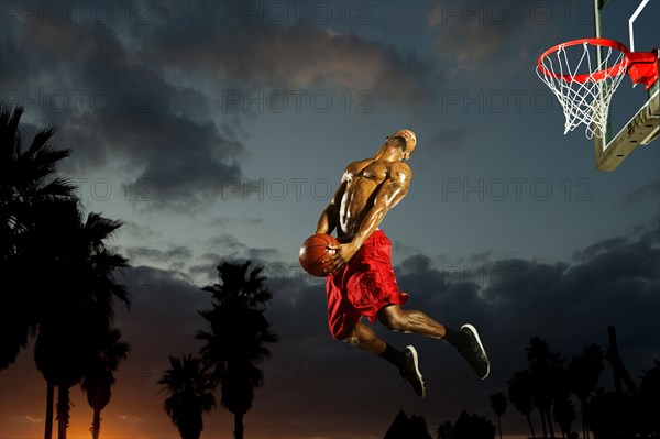 Black man playing basketball