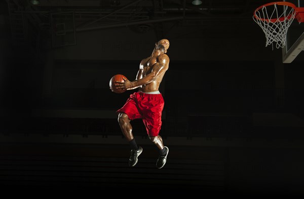 Black man playing basketball