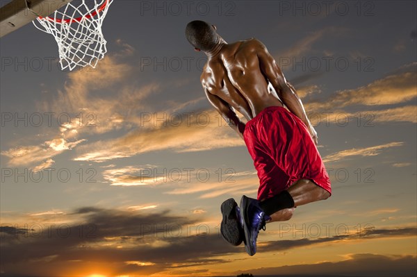 Black man playing basketball