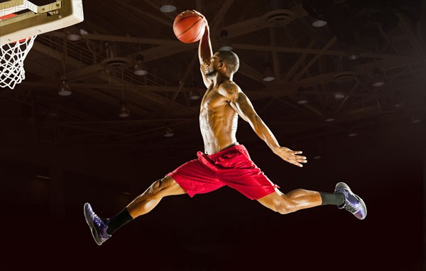 Black man playing basketball