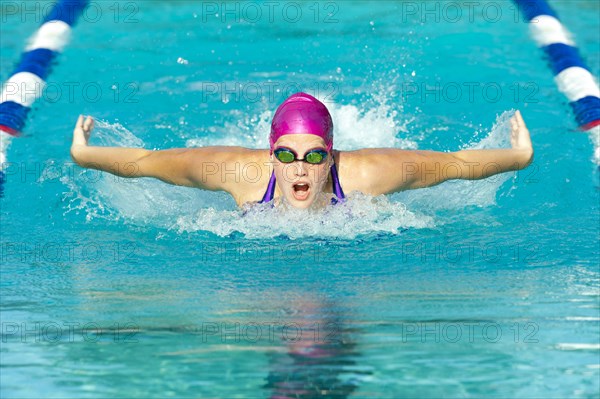 Caucasian swimmer in swimming lane