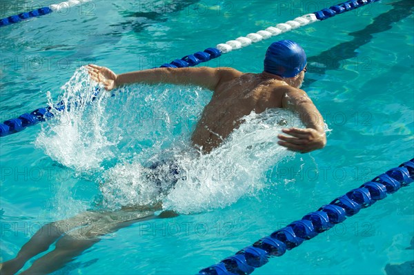 Caucasian swimmer in swimming lane