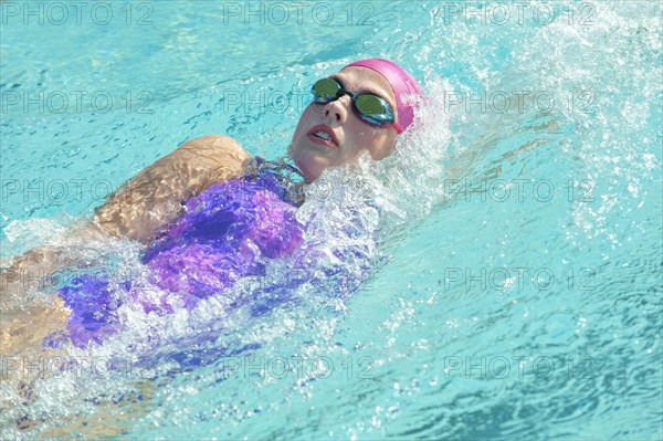 Caucasian woman swimming