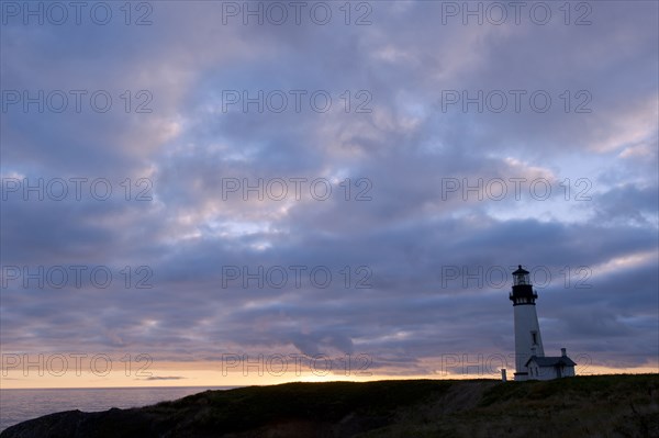 Lighthouse under cloudy sky