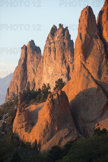 Red cliffs rising in rural landscape