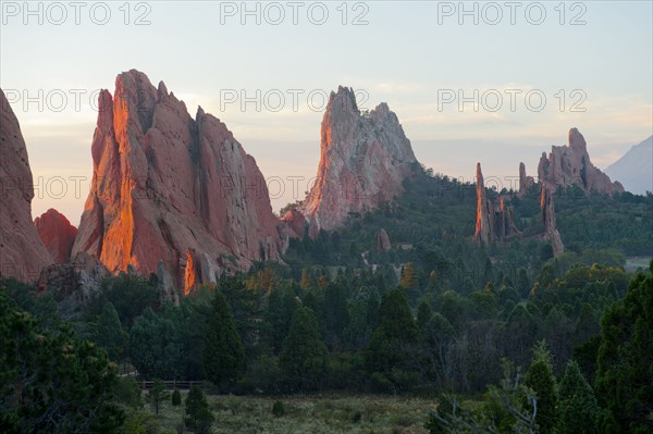 Red cliffs rising in rural landscape