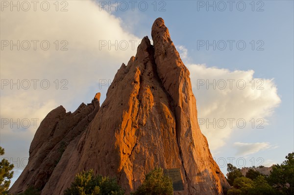 Red cliffs rising in rural landscape