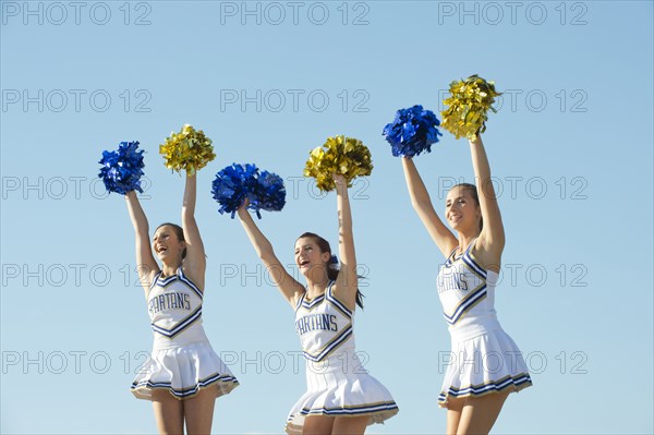 Caucasian cheerleaders posing together